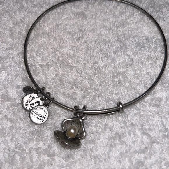 Alex and Ani bangle in silver featuring a Pearl in a oyster shell charm. - Picture 2 of 4